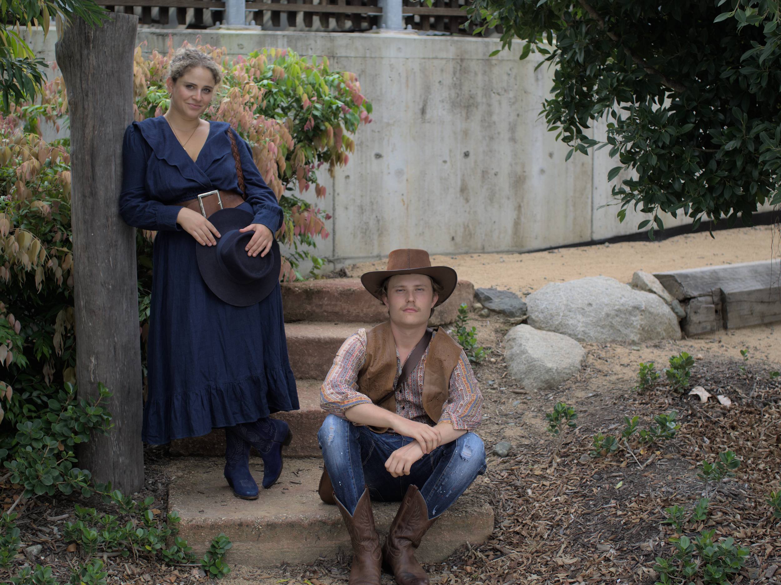 A man and woman in old fashioned clothing