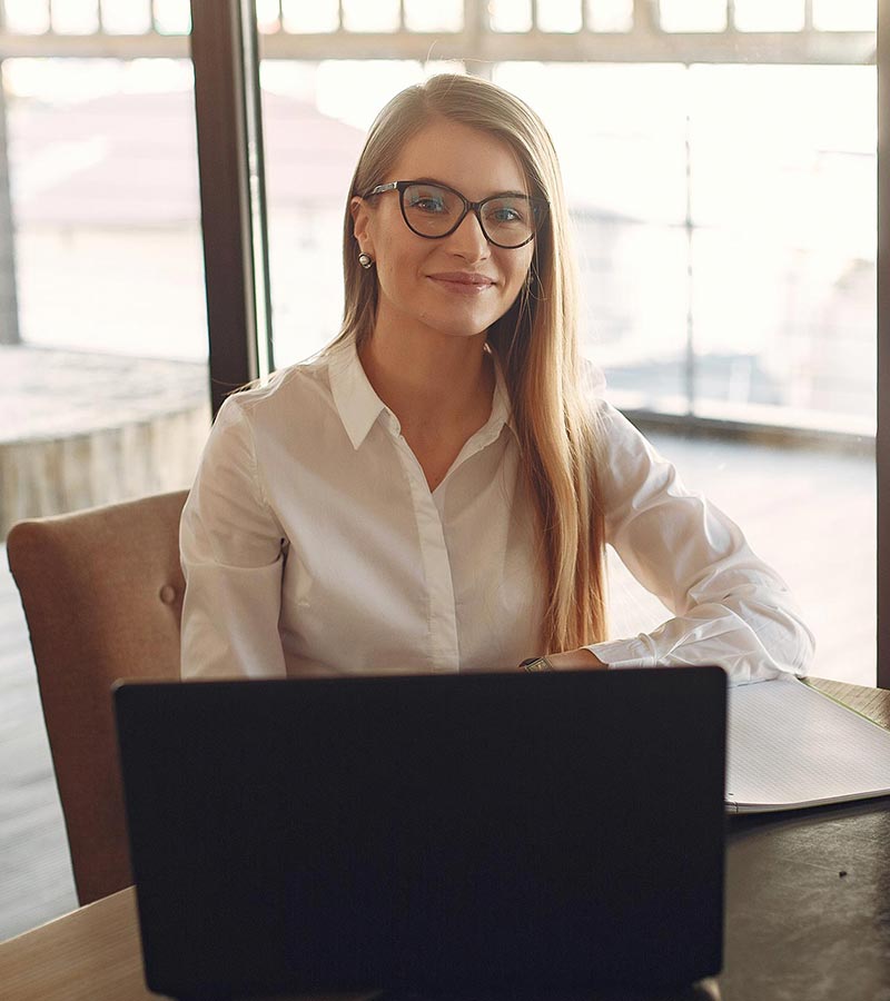A woman with a laptop in the workplace