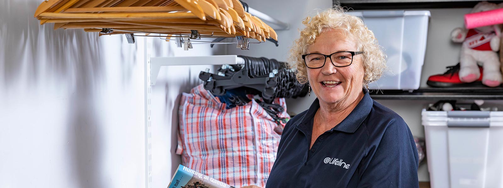 A lifeline shop worker smiling