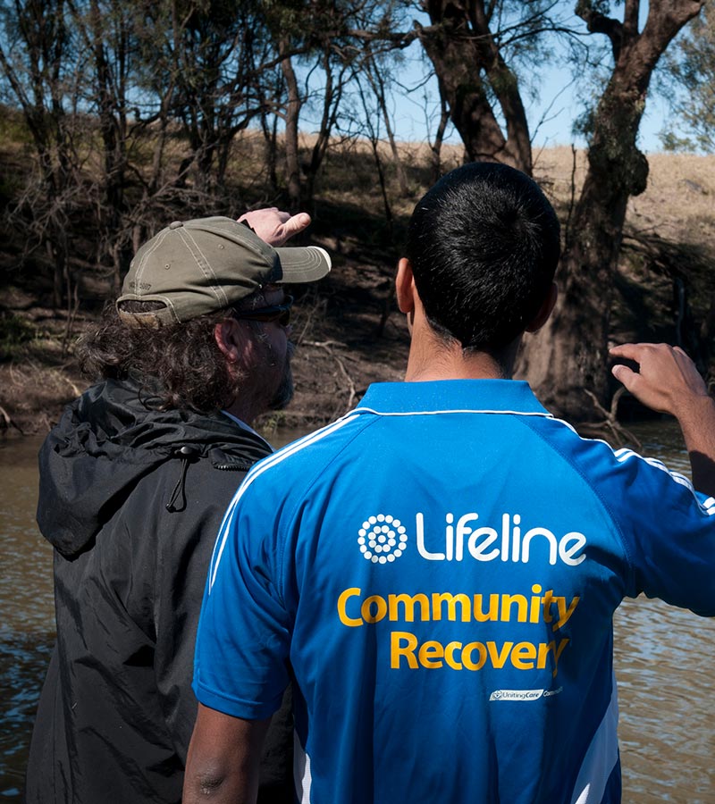 2 lifeline community recovery workers at a river